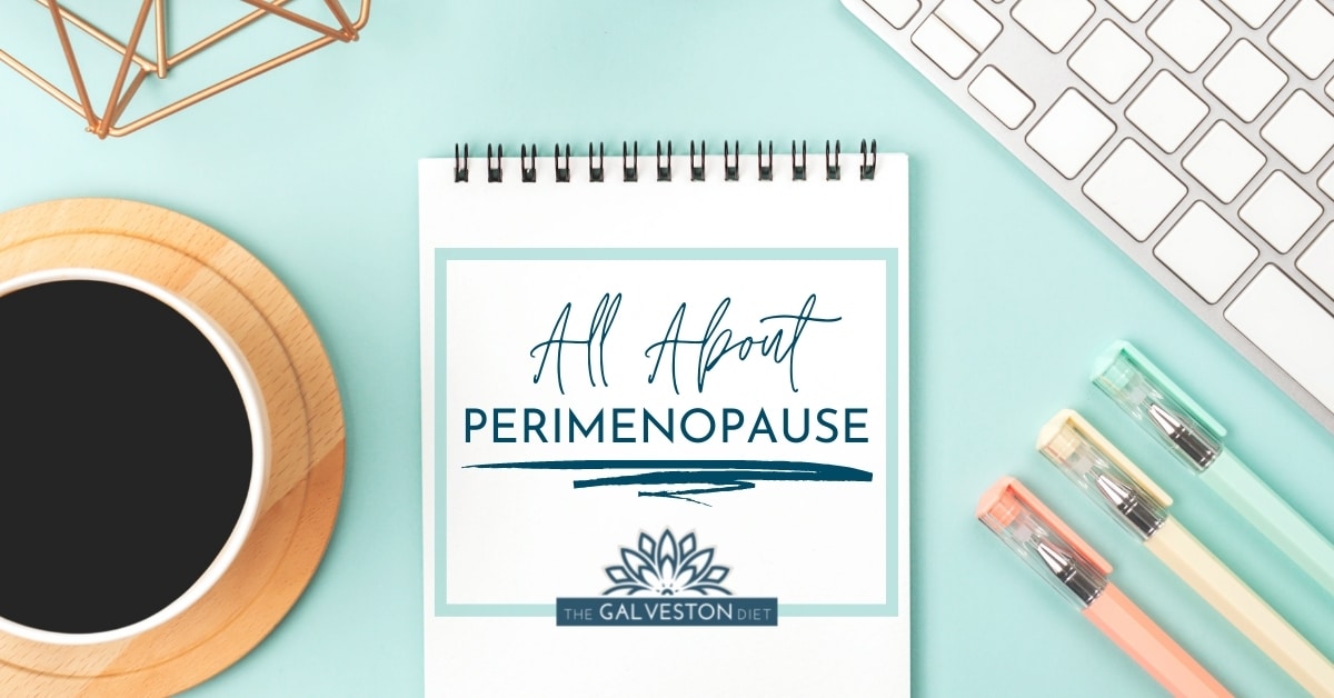 Image of notepad that says "All About Perimenopause" with a coffee cup, keyboard and pastel pens.